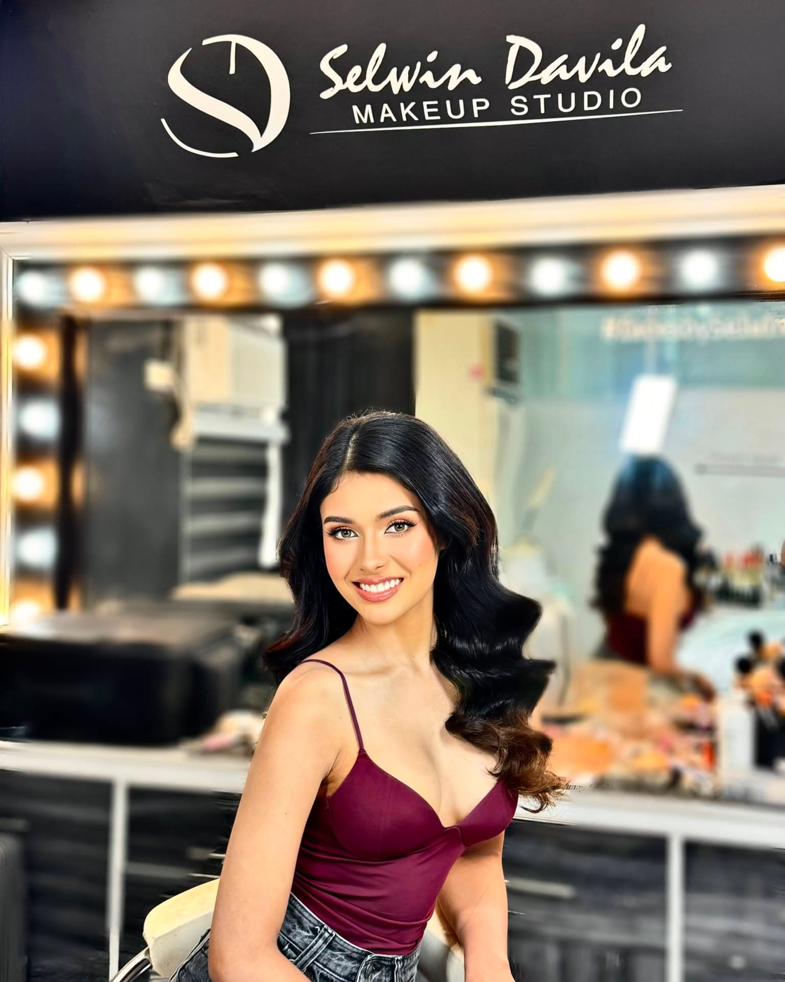 Glamour makeup with warm bronzed tones and a full blow-dry wave